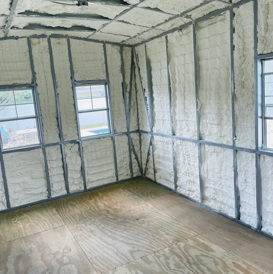 Closed-cell spray foam insulation applied to wall cavities in a residential project in Big Lake